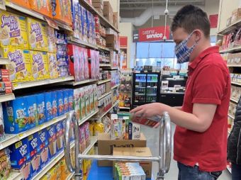 An LCS participant is Stocking Shelves at GFS for an Internship
