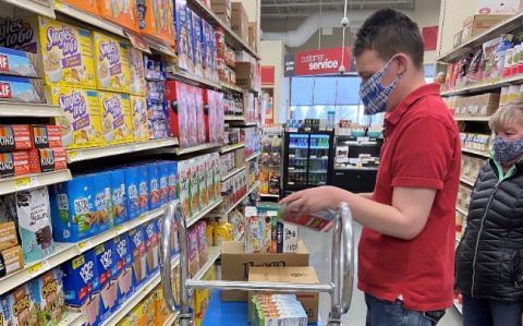 An LCS participant is Stocking Shelves at GFS for an Internship